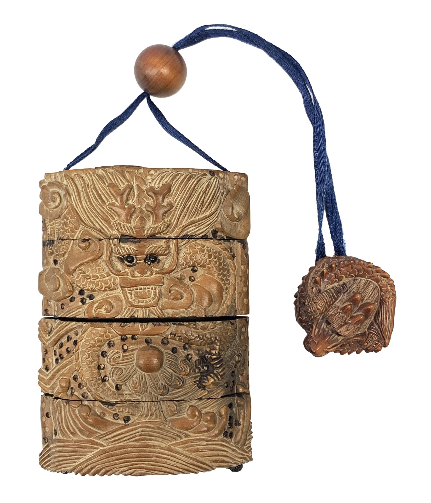 Japanese Meiji wooden four case inro, carved with dragons, with dragon netsuke and ojime bead, H8cm  