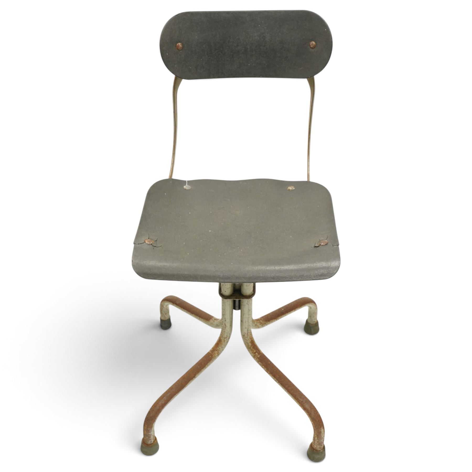 Pair of mid 20th century 'Tan-Sad' industrial chairs, black moulded fibre seats, raised on four supports