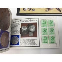Coins and stamps including two United Kingdom 1983 uncirculated coin collections, various uncirculated coins in card folders, various stamp covers and presentation packs from The Royal Mail Millennium collection etc