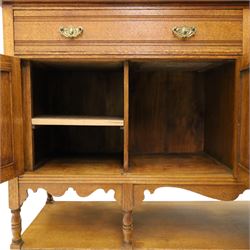 Maple & Co. - Arts & Crafts oak dresser with stained glass cupboard, raised section with pierced pediment above a mirrored back, with a stained glass fronted cupboard with fixed shelf, single long drawer, above a pair of fielded panels, with open recess above a short drawer, raised above a full length undertier with turned supports