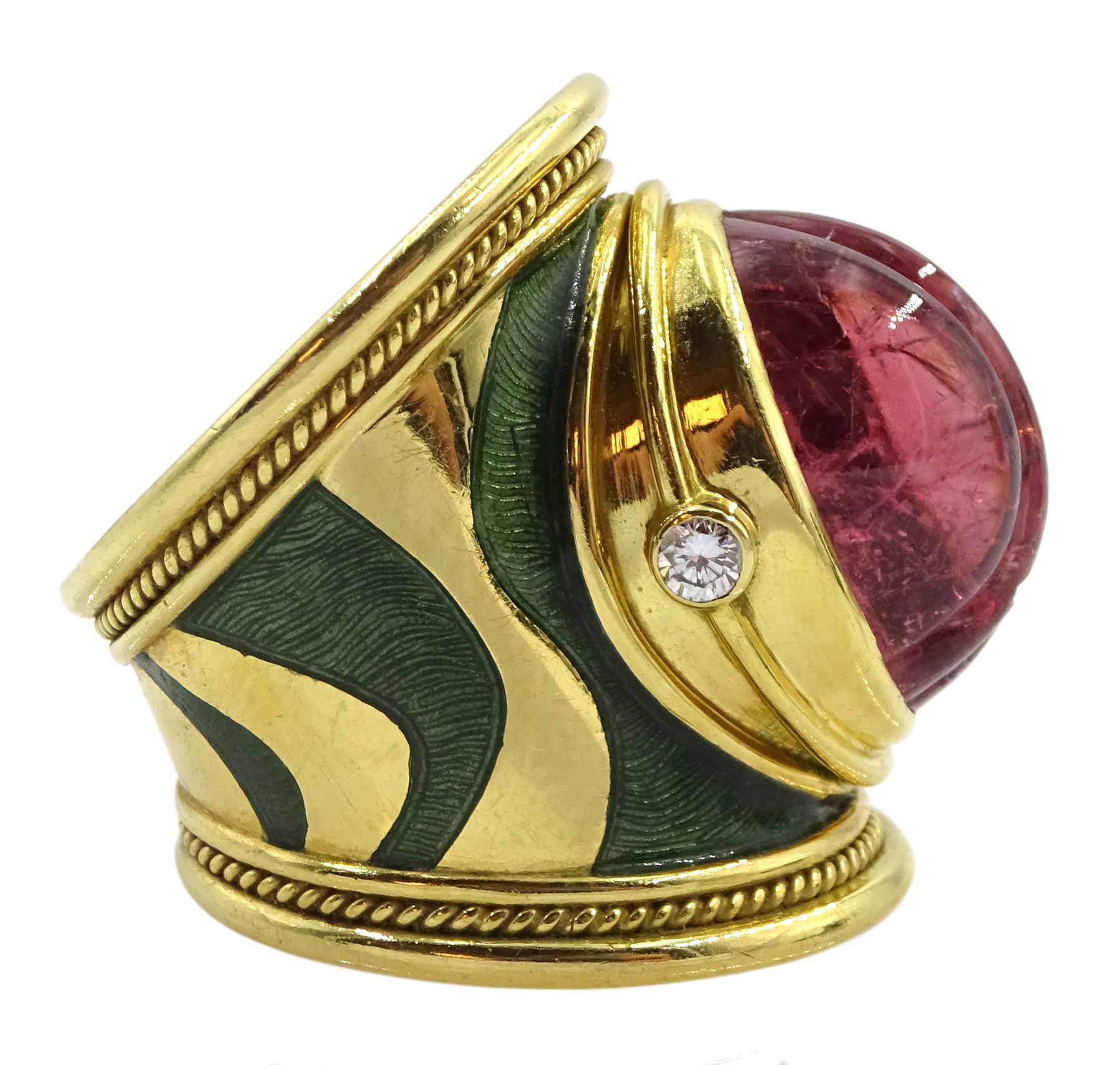Elizabeth Gage 18ct gold tourmaline and diamond tapered Templar ring, the carved oval pink tourmaline cabochon with a round brilliant cut diamond set either side, the band featuring green guilloche enamel and the edges finished with wire-twist-wire decoration, London 1994, in original box