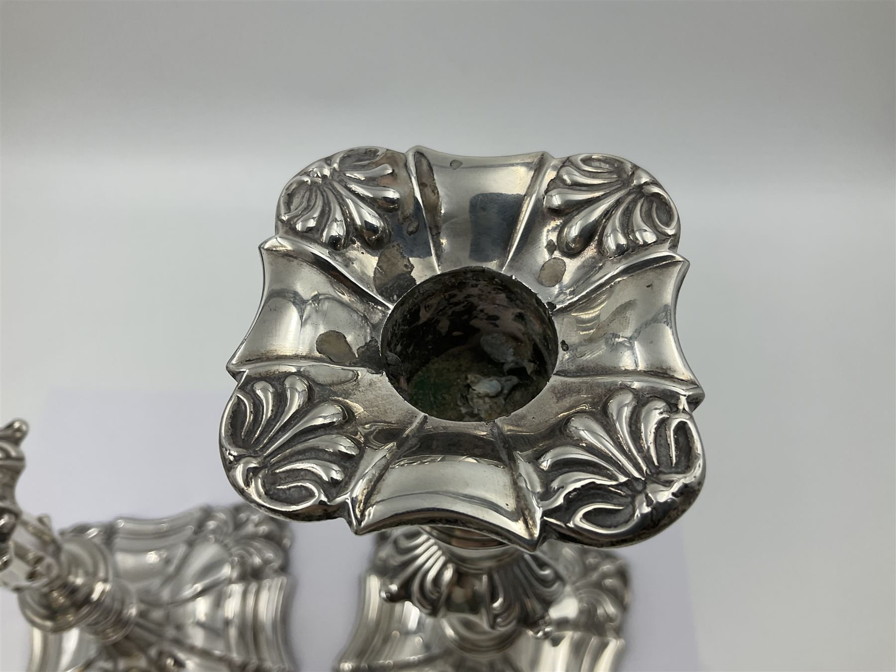 Pair of late Victorian silver mounted candlesticks, each of knopped and part fluted form, upon square stepped base with anthemions to each corner, with conforming sconces, hallmarked to removable sconces and foot, Thomas A Scott, Sheffield 1901, H25.2cm