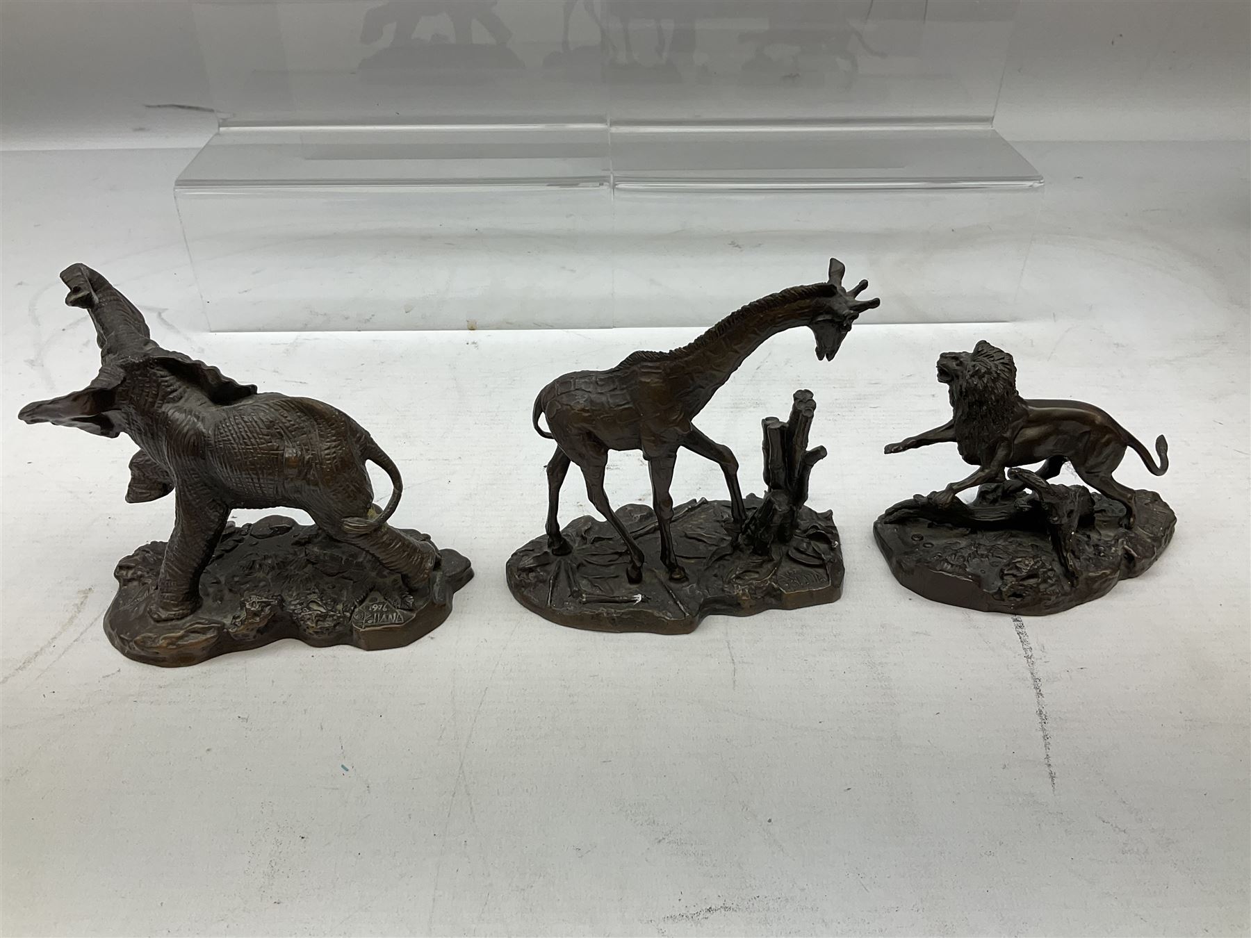 Six Franklin Mint bronze models of African animals, comprising Lion, Black Rhinoceros, Greater Kudu, Cheetah, Giraffe and African Elephant, tallest example H14cm
