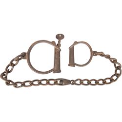 Set of No.8 Hiatt warranted wrought police handcuffs with key, together with another set of shackles, marked hard 