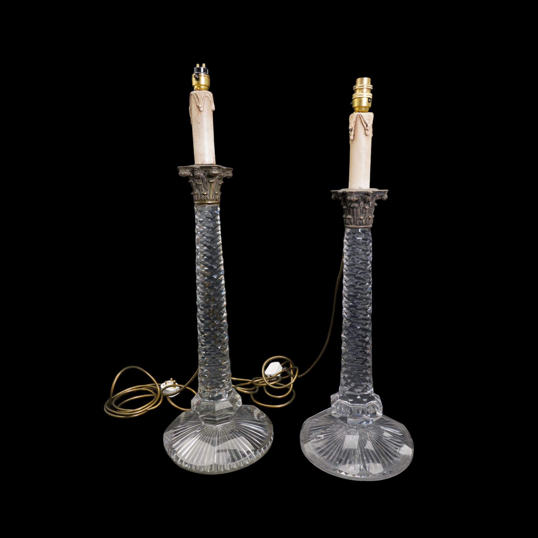 Near pair of large 19th century cut glass table lamps, each of columnar form with diamond cut tapering stem and silver plated Corinthian capital, raised upon a circular faceted foot (one slightly smaller), H71cm overall 