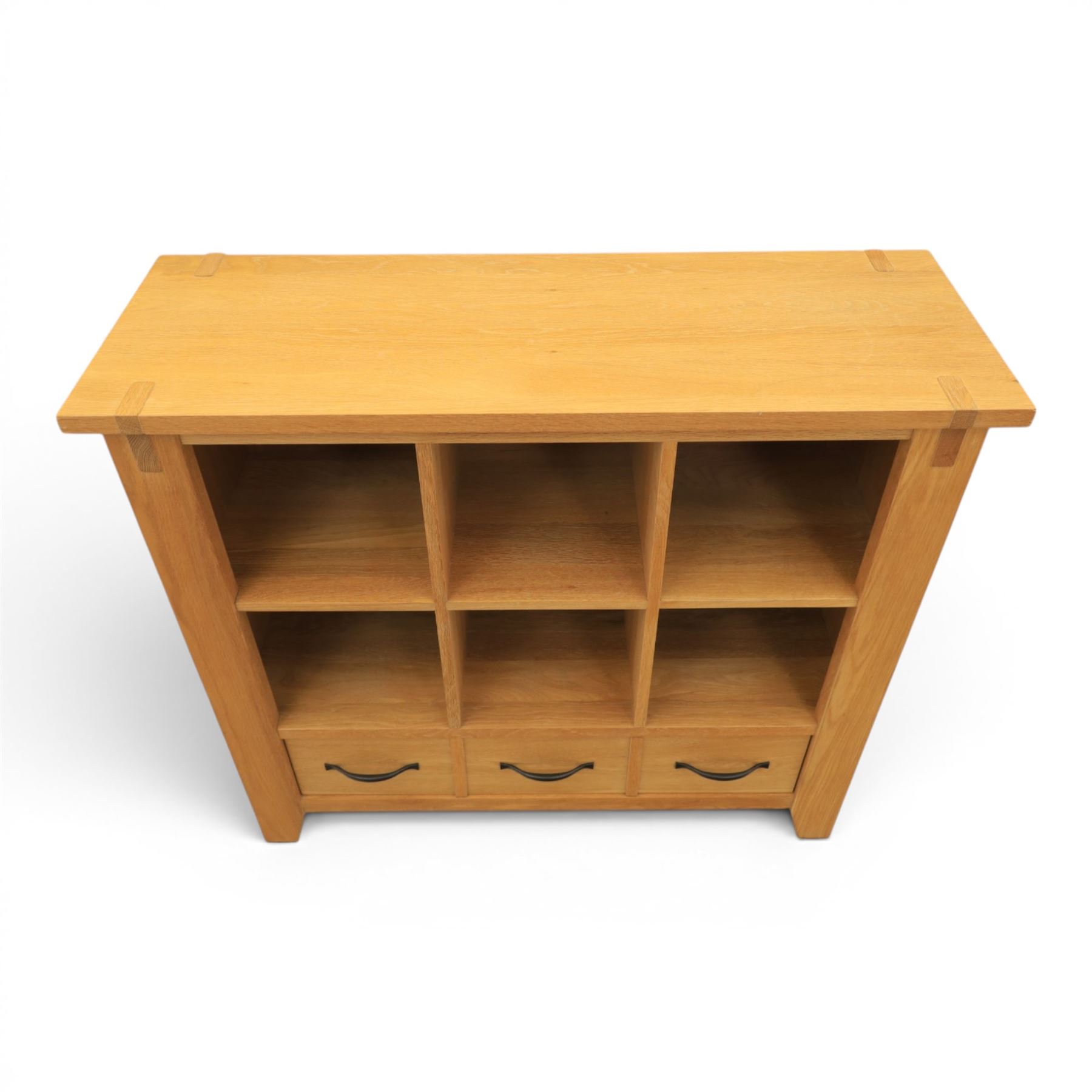 Contemporary Oak cabinet, rectangular top with tenon detailing, two open recess shelves, above a single drawer with blackened metal handles