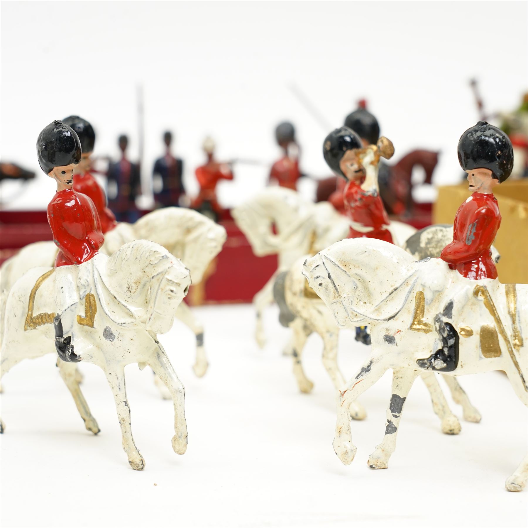 Set of fourteen Johillco lead cavalry on white horses, some with pennants, Britains overseas and colonial foot soldiers and cavalry and a Britains Zouaves box