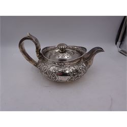 George III Irish silver teapot, of squat circular form, the body with repousse and chased floral and C scroll decoration, with capped C handle and ivory insulators, engraved to base 'Presented to Troop Sergeant Major John Percival, of the 4th Dragoon Guards by Alex D. Tait, Esq, late Captain in that corps as a mark of approbation of his steady and upright conduct when Sergeant Major of his Troop, Dublin, June 2nd 1843', hallmarked William Law, Dublin 1817, H12.5cm, This item has been registered for sale under Section 10 of the APHA Ivory Act