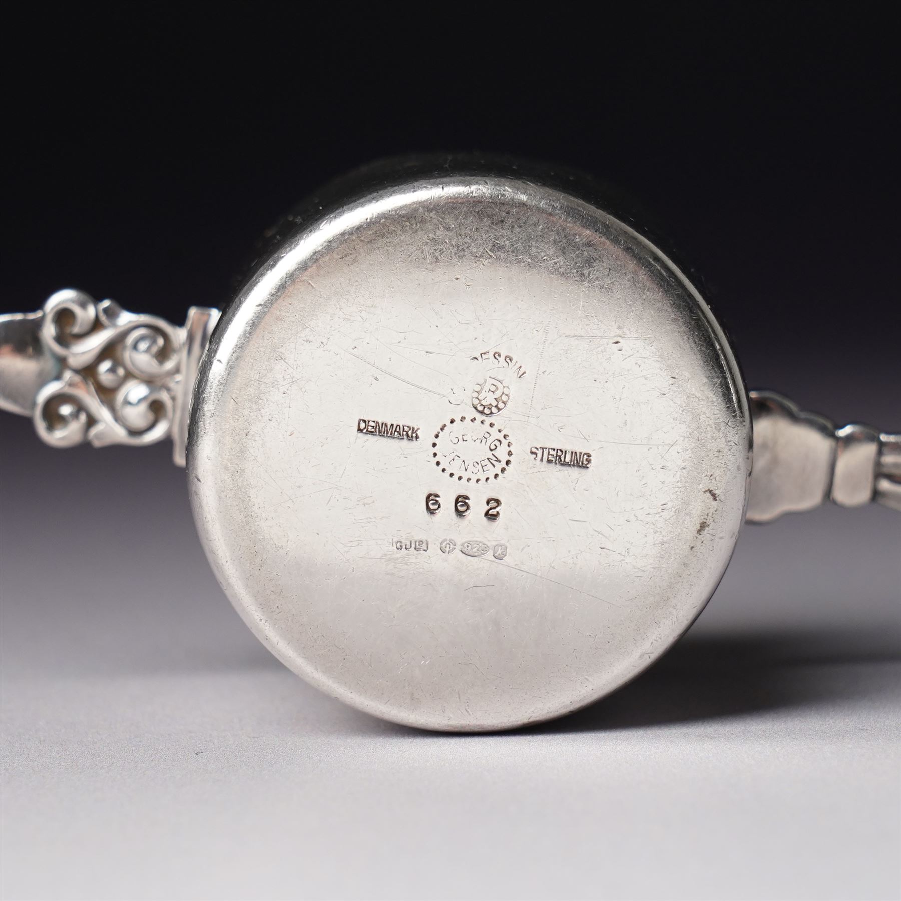 Georg Jensen sterling silver spirit measure of Art Deco design with flattened handle and a silver sugar caster Birmingham 1959