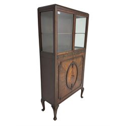 Mid-20th century mahogany display cabinet, two glazed doors above rail carved with flower heads, two figures doors below with applied flower head oval garland and geometric mouldings, on acanthus carved cabriole supports 