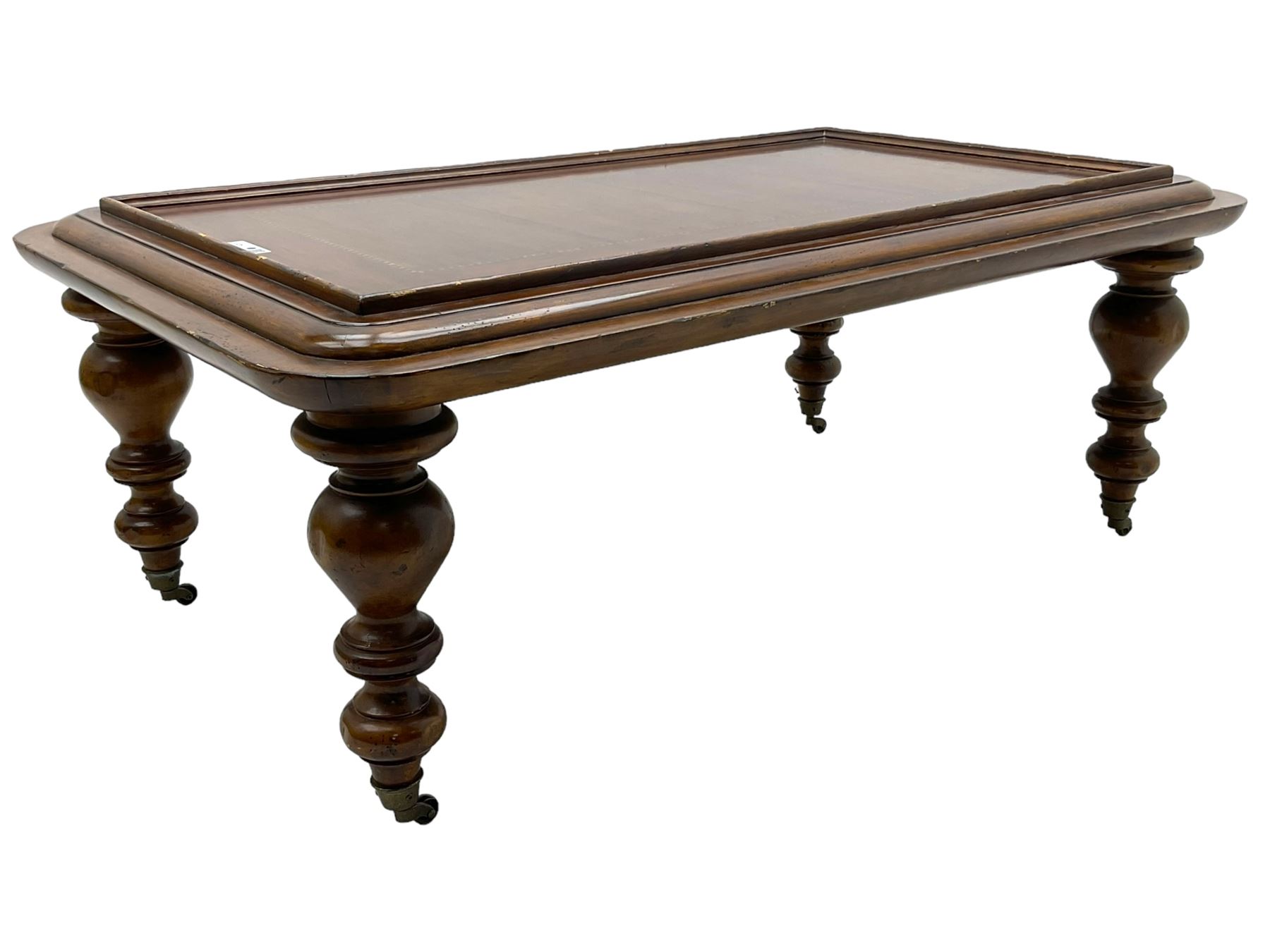 Milling Road - cherry wood coffee table, rectangular top with rounded corners, on turned feet with castors