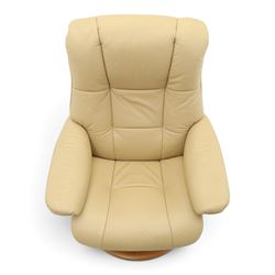 Ekornes Stressless - beech framed reclining swivel armchair with matching footstool, on U-shaped supports with circular bases, upholstered in beige leather