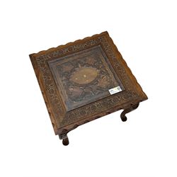 Pair of Pakistan carved hardwood brass inlaid lamp tables, square form, cabriole legs, inset glass tops