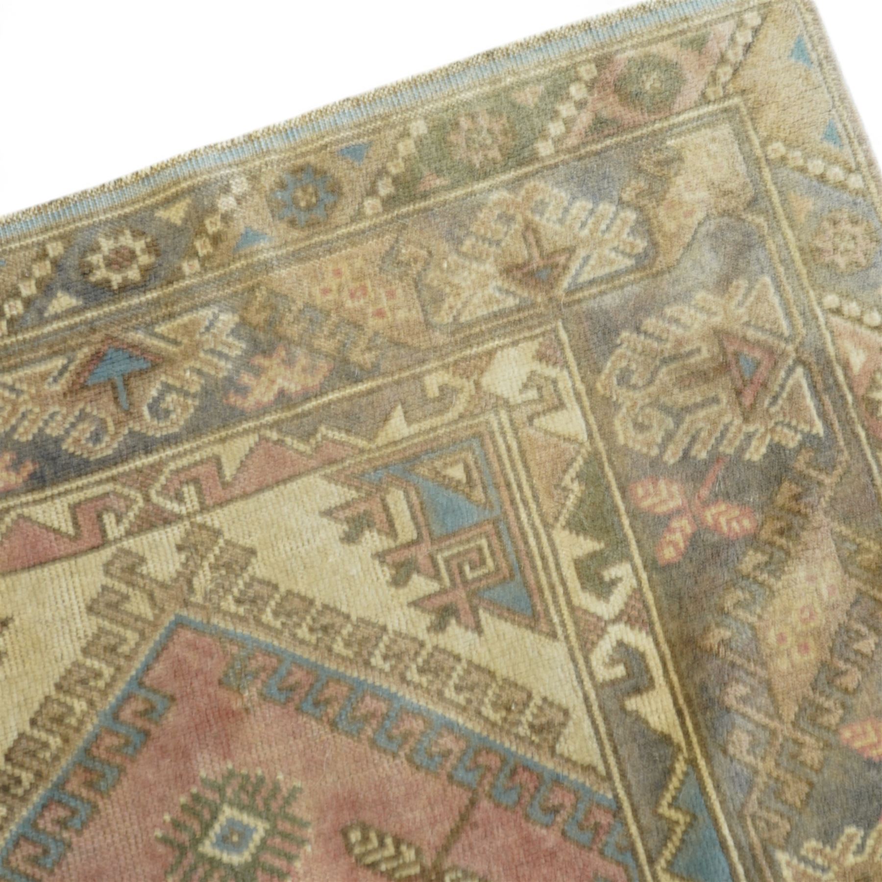 Persian crimson ground rug, decorated with small geometric motifs and animals (158cm x 83cm); together with a Turkish rug (206cm x 119cm)