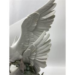 Large Lladro figure group, Swans Take Flight, modelled as two swans upon raised on circular wooden plinth, sculpted by Salvador Debon, H68cm