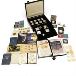 Mostly commemorative coinage, including various Queen Elizabeth II crowns, The Royal Mint United Kingdom 1999 silver proof five pounds, Canada 1999 one ounce fine sliver five dollars, Bermuda 2000 two dollars, Guyana 2000 two-thousand dollars, New Zealand 2000 ten dollars etc, housed in a coin display case and loose