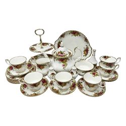 Royal Albert Old Country Roses pattern tea service for six, comprising teapot, sucrier, milk jug, dessert plates, one cake plate, one two tiered cake stand, salt and pepper pots and bud vase 