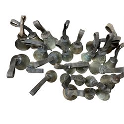 Collection of 44 late 19th century brass church/musical handbells with leather straps by James Shaw Brothers of Bradford and bells marked G.W. possibly cast by the George Welch bell foundry, London.
The number of bells and stated notation, some at different pitch, is as follows;
5 “C”, 4 “D”, 5 “E”, 4 “F”, 5 “G”, 5 “A”, 6 “B”.
3 “F#”, 4 “C#”,1 “Db”, 1 “G#”, 1”A#”.
Two of the bells are minus their clappers and one bell has no leather strap.
