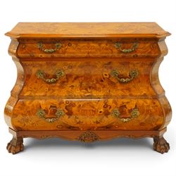 Colombo Mobili - Italian walnut and floral marquetry bombé commode chest, rectangular top with canted eared corners inlaid with urn motif and trailing scrolling foliage, fitted with three long graduating drawers with gilt metal handles, profusely inlaid with scrolling acanthus leaves interspersed with urns and cartouches, on large carved ball-and-claw feet