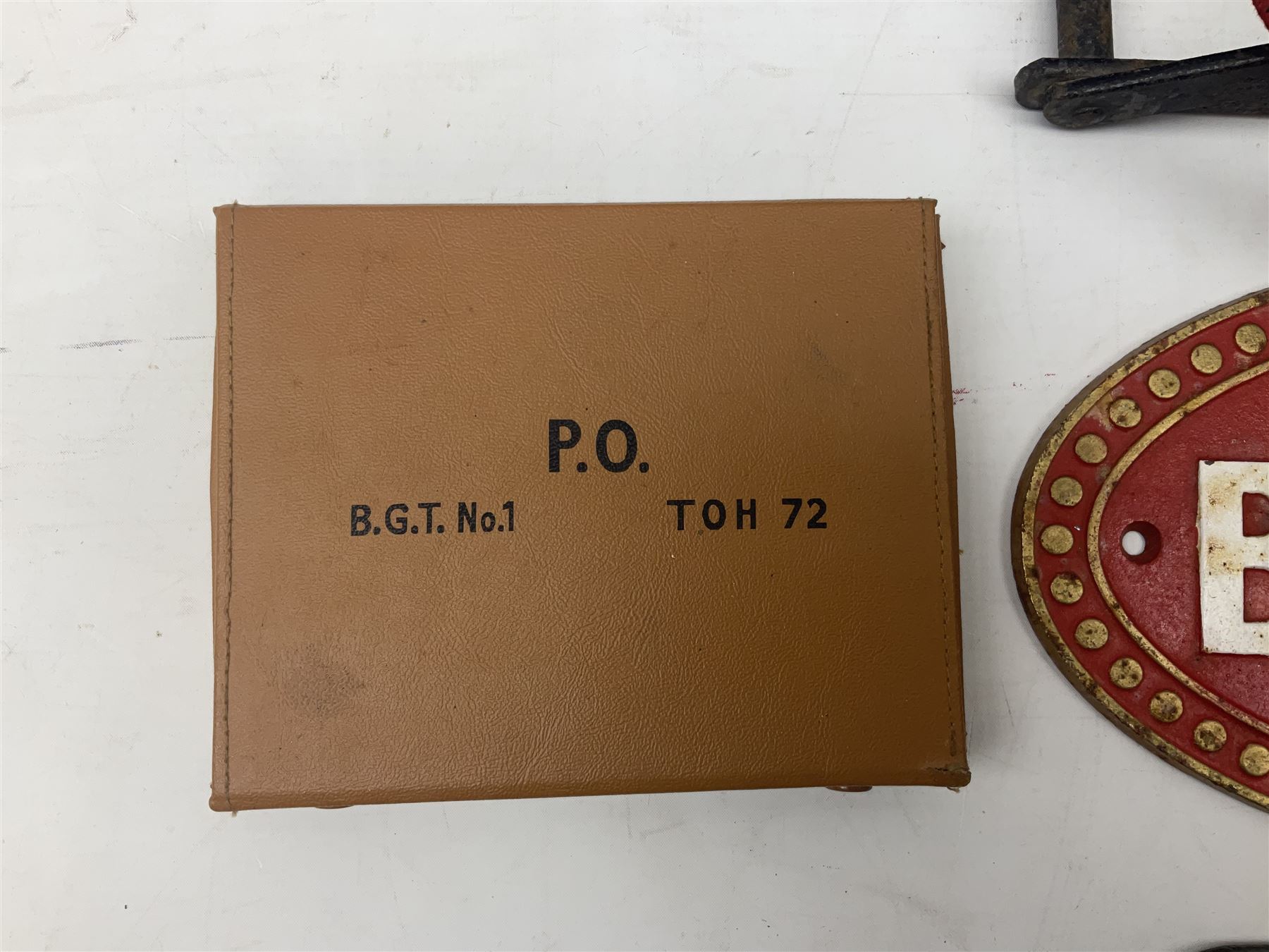 Bugatti cast iron sign with a red background, Shell Oil cast iron sign with gold background, together with Land Rover oil can, motorist warning lamp & torch tool kit and other motoring items 