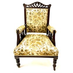 Edwardian mahogany framed gents salon armchair, shaped carved and pierced cresting rail, upholstered back seat and arms, turned supports 