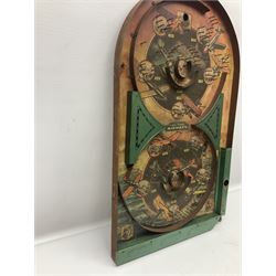 1934 Lindstrom's 'Airways' tin-plate bagatelle game by Lindstrom Tool and Toy Company Bridgeport Conn., the decorative bagatelle board depicting Lindstrom's epic airway routes; with wooden peg and quantity of balls H61cm