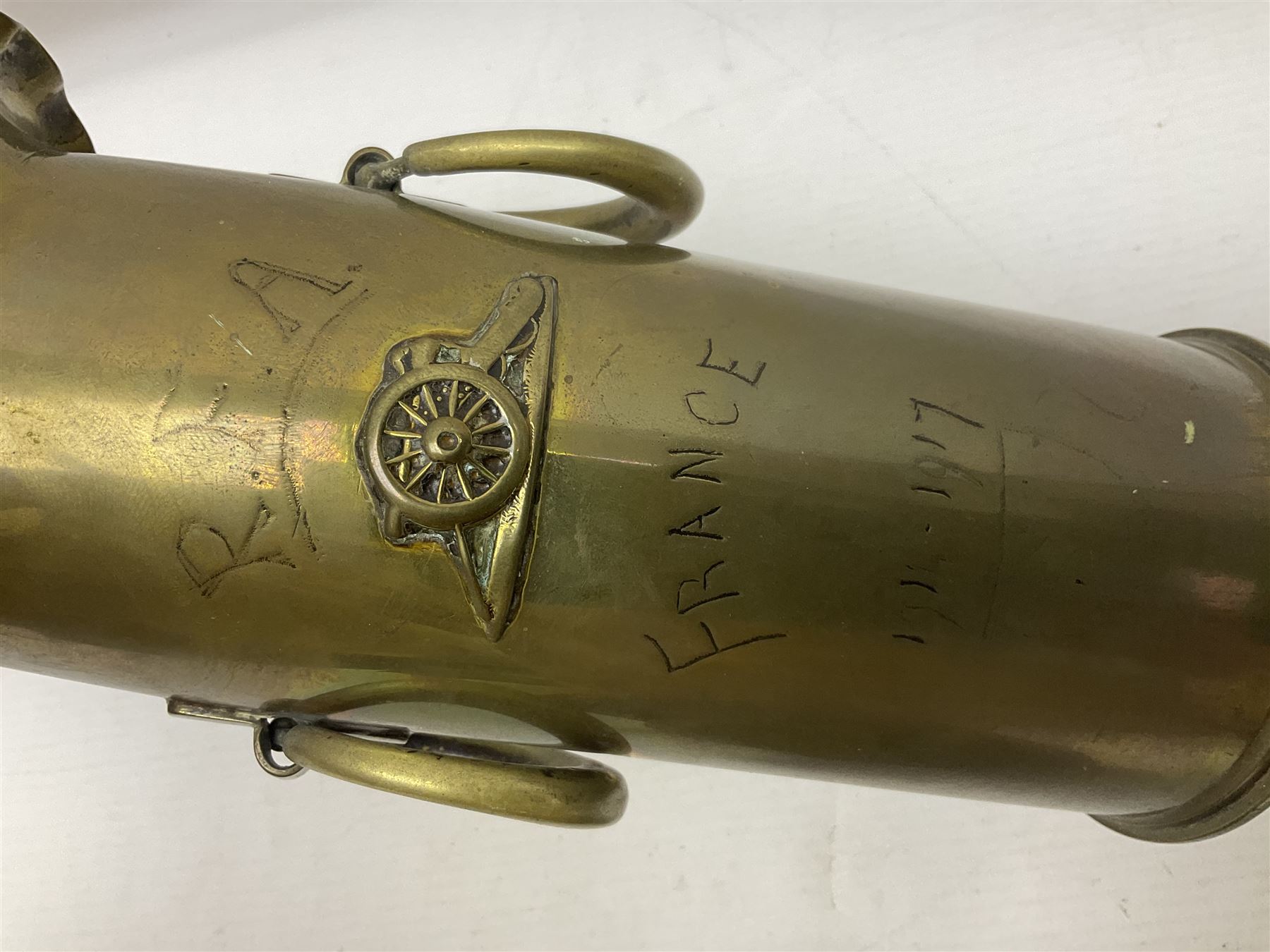 Trench Art - WWI 0-8-0 steam locomotive made from brass, copper and late Victorian pennies and half-pennies L17.5cm; WWI brass and copper tank candleholder; WWI brass shell case two-handled vase inscribed 'RFA France 1914-17'; and an unrelated brass plant holder (4)