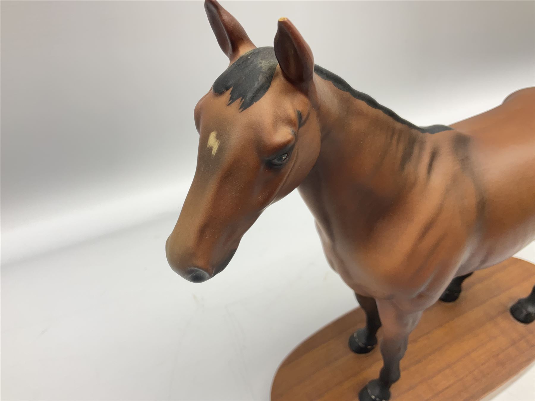 Beswick 'Mill Reef' horse figure, on a wooden plinth together with Beswick Ware horse figure 'Red Rum' on wood plinth, both with printed mark beneath