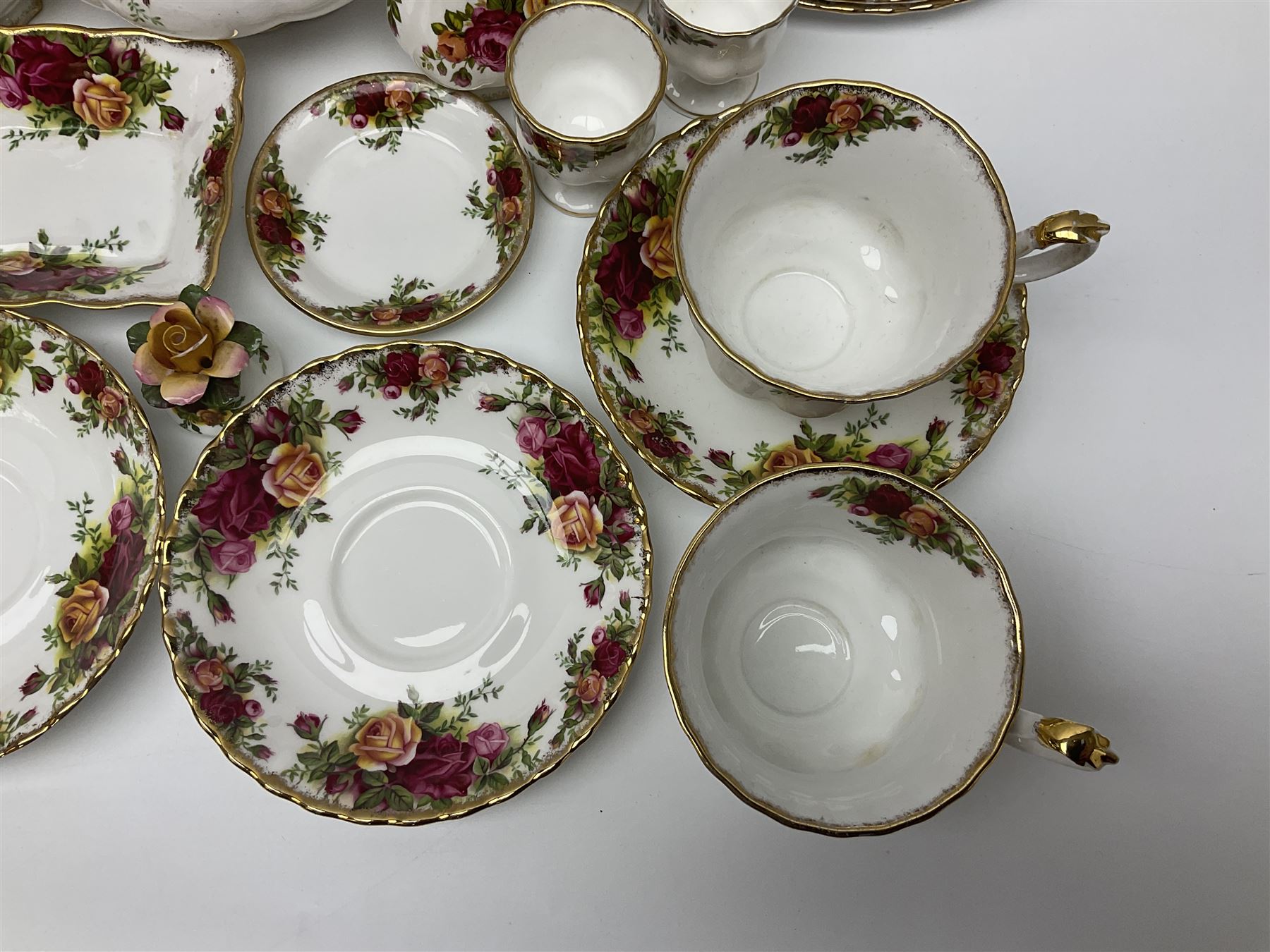 Royal Albert Country Roses pattern part tea and dinner service, to include teapot, four cups and saucers, four dessert plates, cake plate etc, (41)