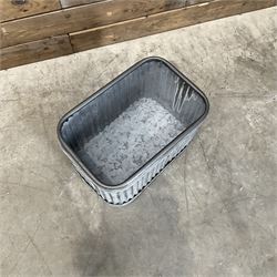 Set of three pressed metal planters in different sizes