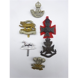 Six cap badges including Durham Light Infantry, 12th London Rangers, Leicestershire Regiment, 15th/16th London Westminsters (KRRC) etc