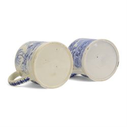 Two large 19th century blue and white transfer decorated pearlware mugs, the first example depicting a Chinese landscape with pagoda, and figures at rest and play, the second a pastoral landscape with shepherd and goats by waters edge, each approximately H12.5cm