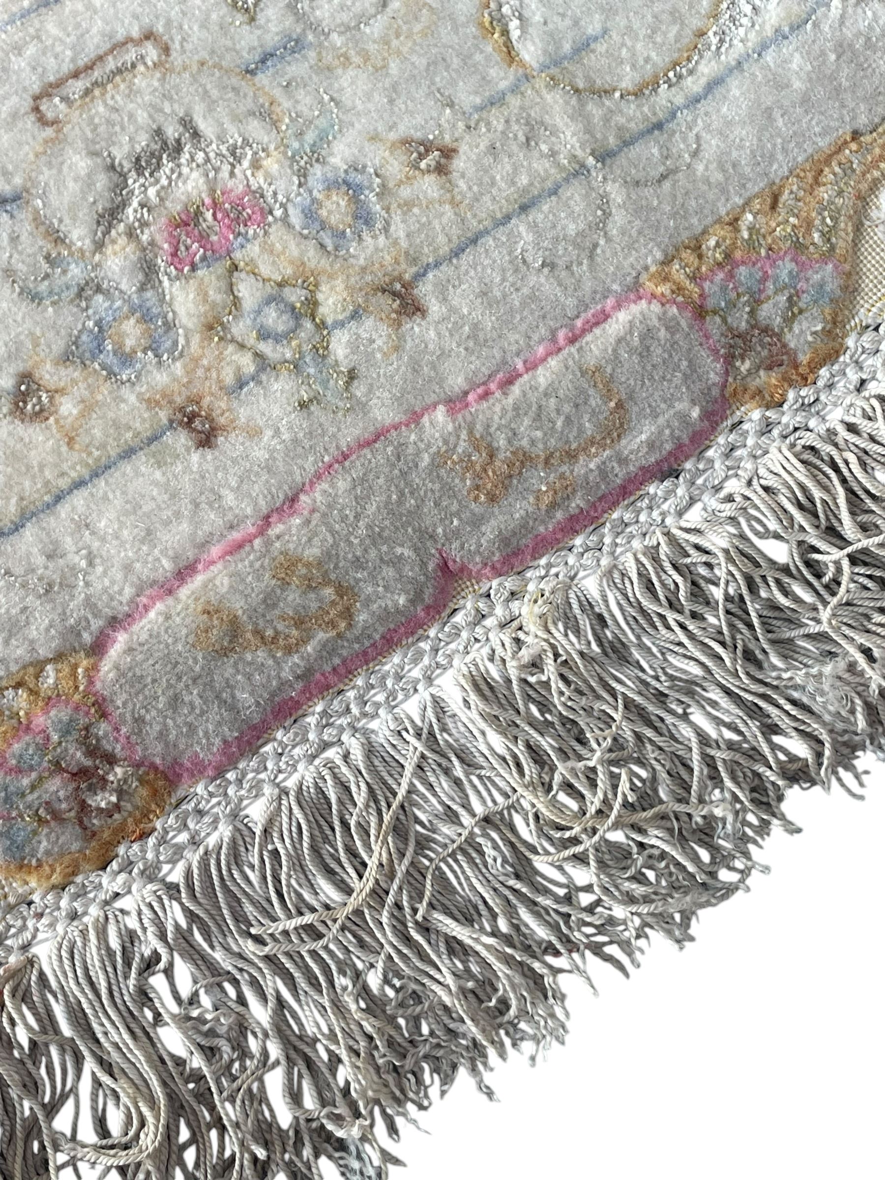 Persian Mahal densely knotted ivory ground carpet, floral rosette medallion surrounded by interlacing leafy branches and palmettes, scrolling border decorated with foliate motifs, within guard stripes, with signature panels to each end