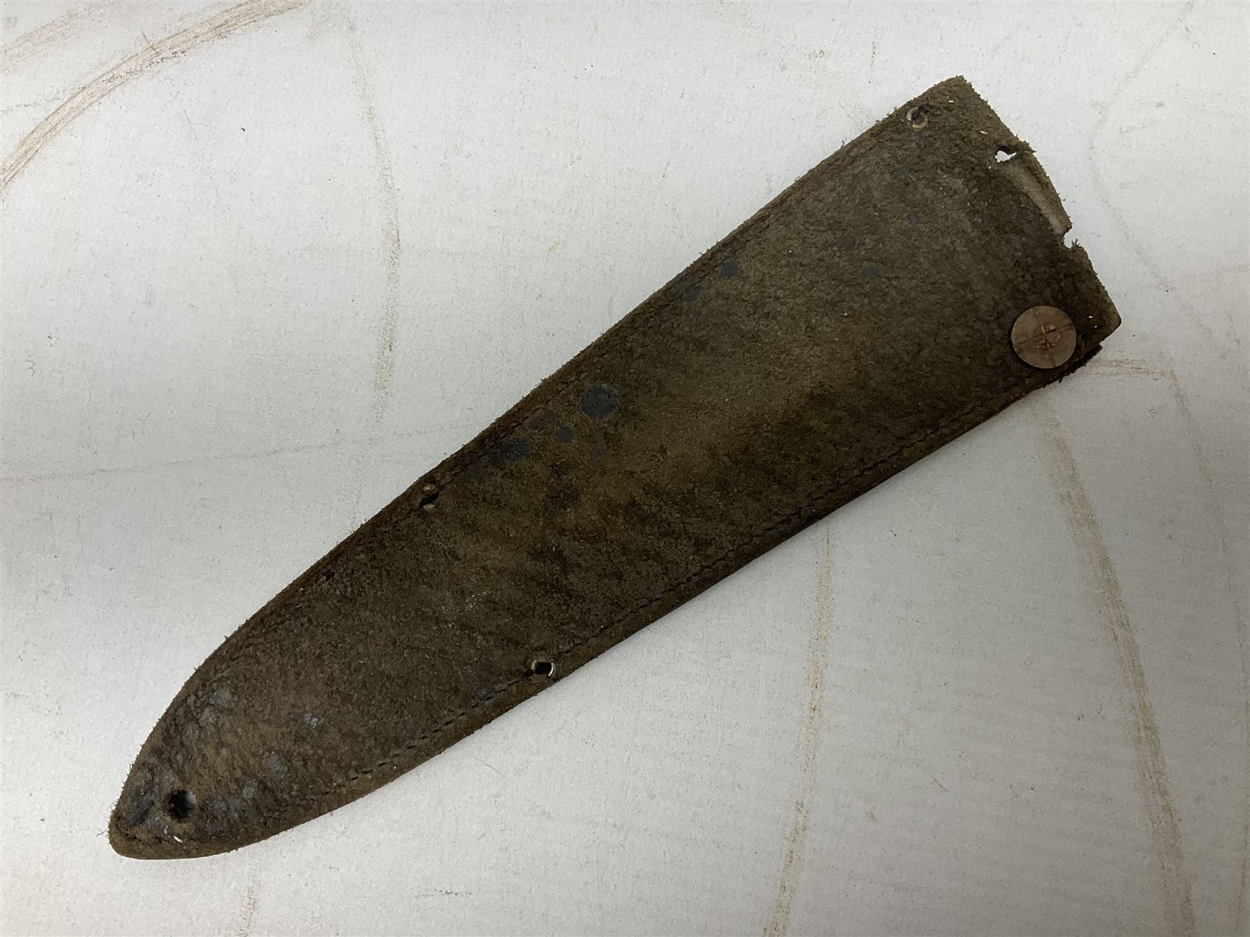 Fairburn and Sykes Commando fighting knife, 3rd pattern with 17cm double edged blade and copperised grip; no markings; in cut-down plain leather sheath L31.5cm