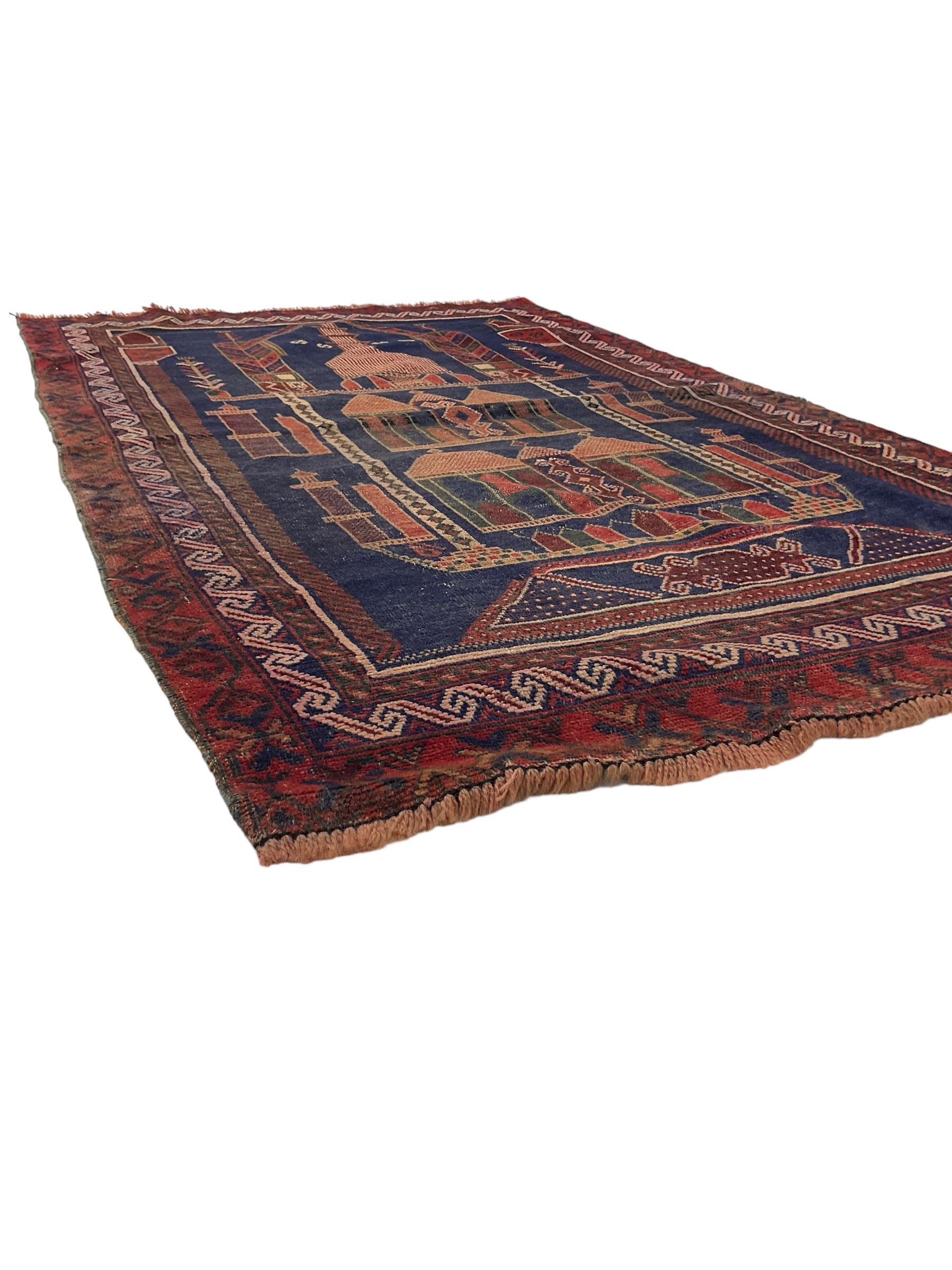 Persian Baluchi prayer rug, blue ground field decorated with Mosque and cityscape, the border with repeating geometric designs 