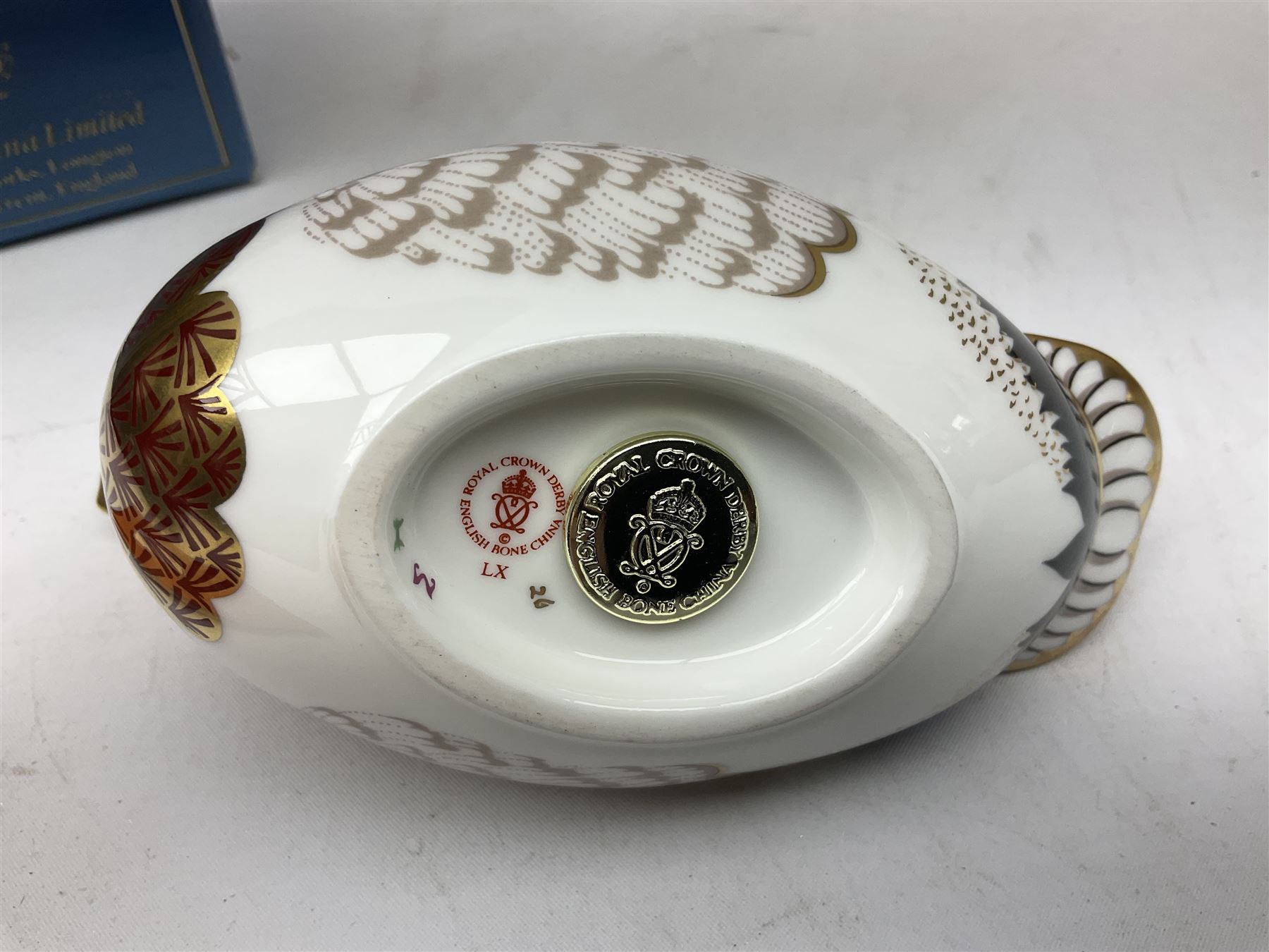 Royal Crown Derby paperweight in the form of a mallard duck, with gold stopper, together with Aynsley Orchard Gold lidded jar, bell, dish and plate, and Derby Posies pattern jar and cover, four with boxes