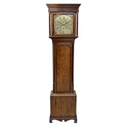 George III oak and mahogany banded longcase clock, the hood with projecting cornice over blind fret work frieze and plain column pilasters, brass dial and Roman chapter ring with subsidiary seconds and calendar dial, decorated with ornate mask cast spandrels, the case with canted corners and plain quarter columns, trunk door with shaped top and moulded edge, on shaped skirt