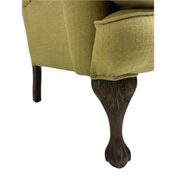 Queen Anne design hardwood framed wingback armchair, upholstered in green fabric with buttoned back, on acanthus carved ball and claw cabriole feet