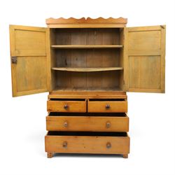 19th century waxed pine press cupboard, shaped cornice above a twin fielded panelled cupboard door enclosing a fixed shelf, the lower section two short two long drawer