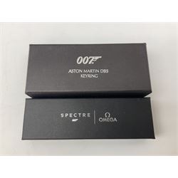 Limited edition framed James Bond 007 Skyfall print, 126/600, boxed Spectre pen, Aston Martin DB5 keyring and sealed 007 50th Anniversary Edition boxed monopoly game (4)