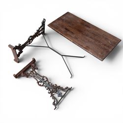 Pair of Victorian cast iron table end supports, of pierced and scrolling foliate design wi...