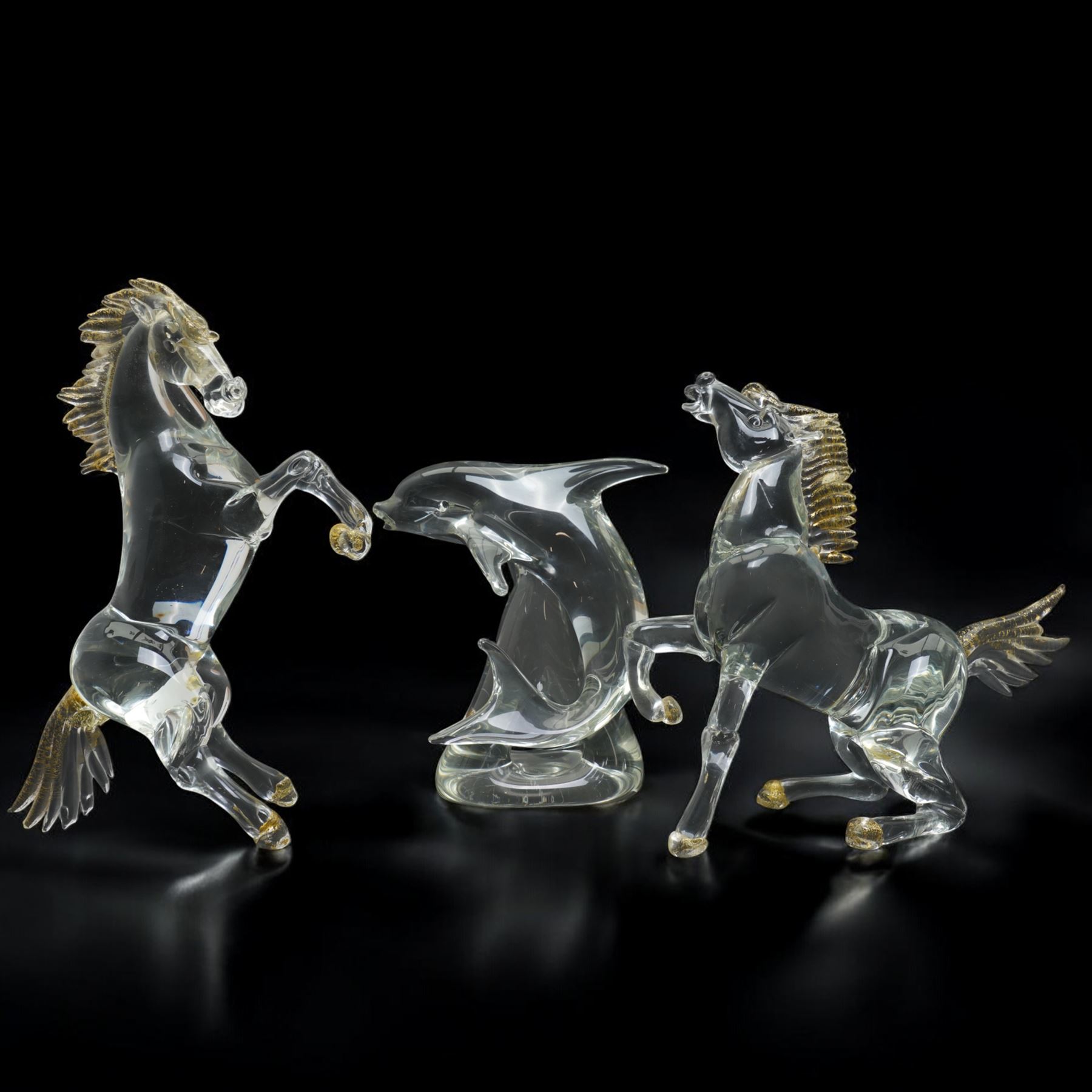 After Oscar Zanetti - Two Murano glass rearing horses with aventurine details to mane tail and hooves, larger 35cm and a Murano dolphin H24cm (3)