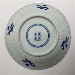 18th century Chinese blue and white Kangxi dish, decorated in the Long Eliza pattern, within a lappet border, four character Kangxi mark beneath, D13cm