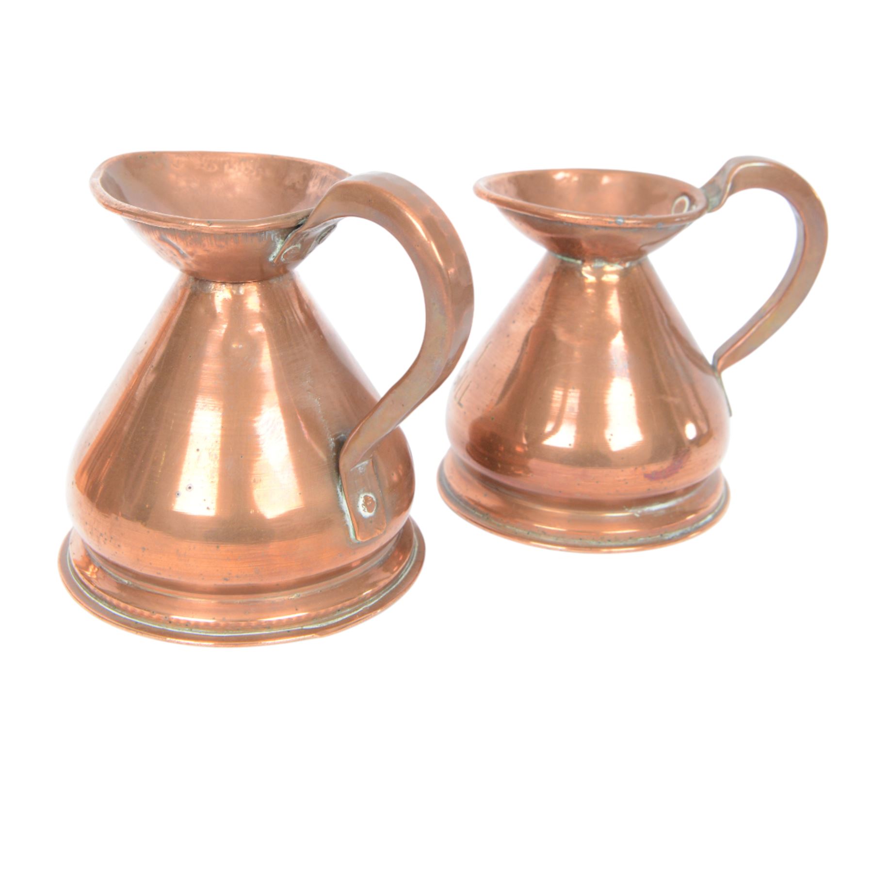 Copper and brass measures, including set of three copper jugs, set of four graduating brass pans and two sets of copper and brass cup measures