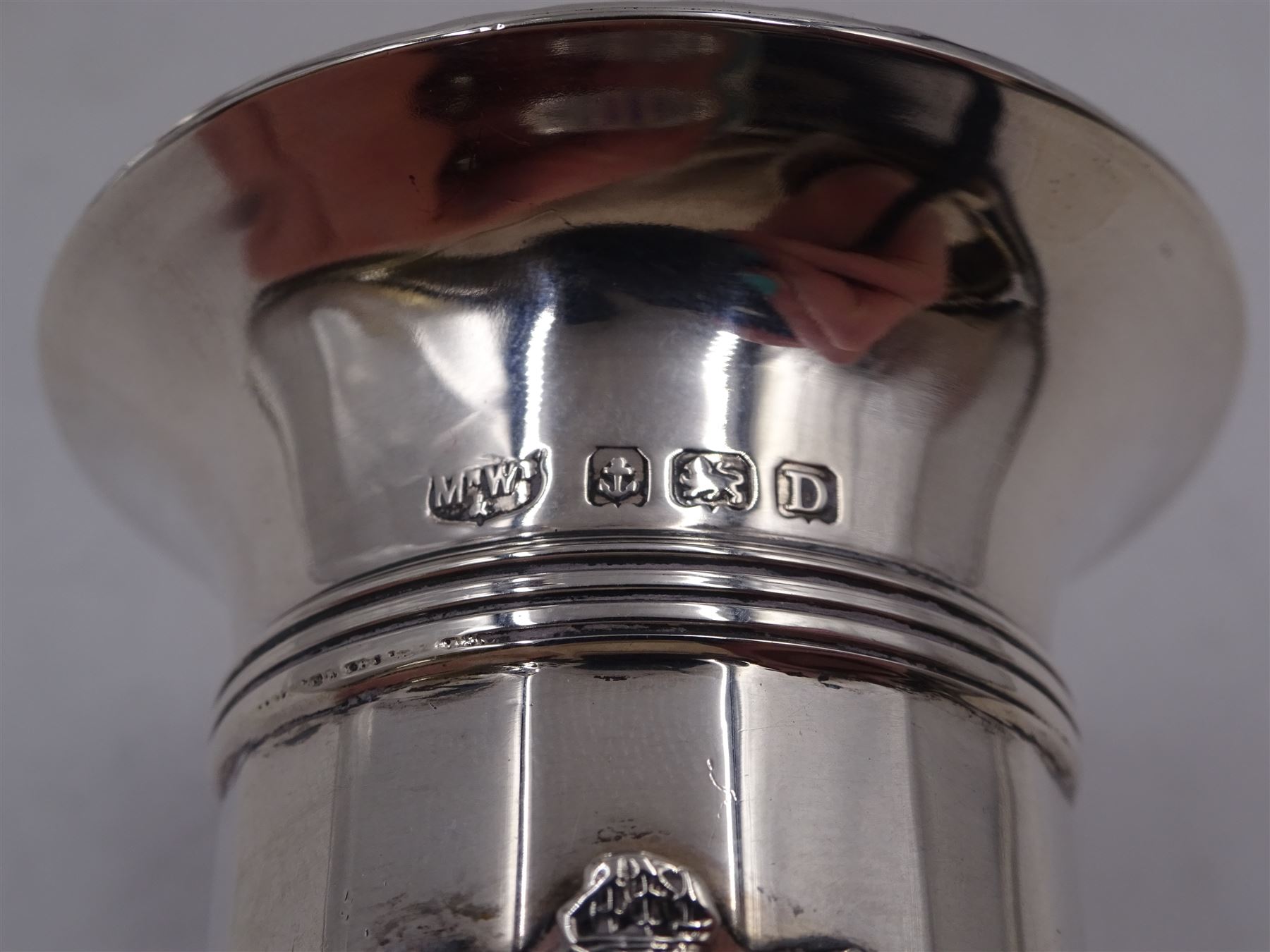 1920s silver trumpet vase, with shaped rim and knopped stem, upon spreading filled foot, H23cm, hallmarked Marson & Jones, Birmingham 1927, together with a smaller example, of faceted form, with dart rim and applied enamel crest, with 'S.S.Orford' inscribed on enamel plaque below, upon stepped filled foot, H12.5cm, hallmarked Mappin & Webb Ltd, Birmingham 1928