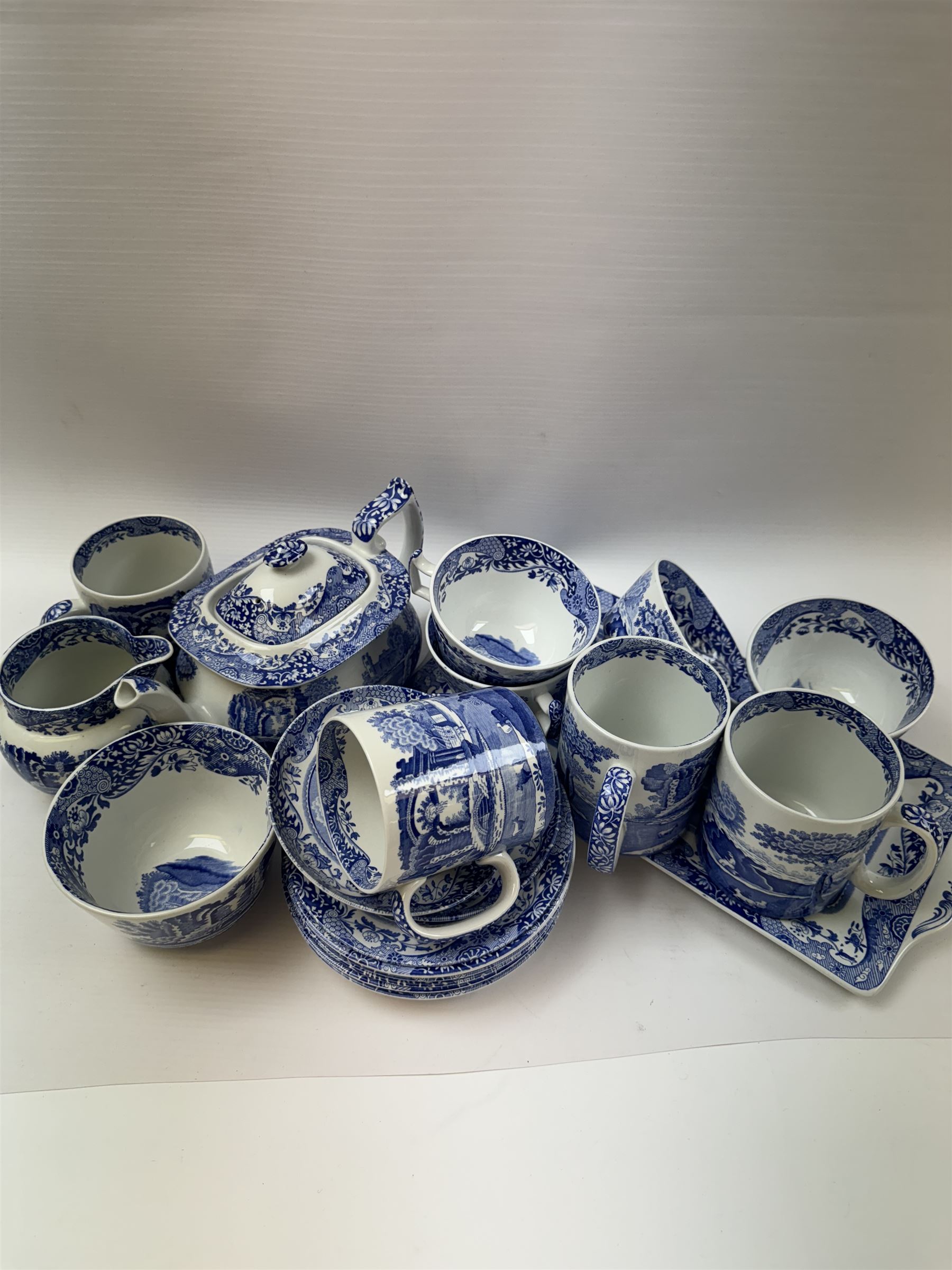 Spode Italian pattern tea service, comprising teapot, milk jug, open sucrier, six cups and saucers, two coffee cans and saucers, six dessert plates, four mugs and a sandwich plate (30) 