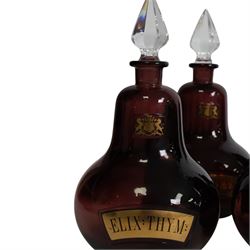 Set of four 20th century Royal Pharmaceutical Society amethyst glass bottles, of bellied form with clear cut glass spire stopper, each body bearing gilt label in Latin: ELIX:THYM:, ELIX:CAMPH:, ELIX:ANIS: and ELIX:SENN:, and gilt Royal Pharmaceutical Society crest to neck, H25cm

Provenance: From the collection of the family of Peter Green, a practising pharmacist whose career spanned the mid to late 20th century. During his professional life he managed pharmacies in Yeovil, Somerset, and later Selles Chemist in Filey, North Yorkshire, before purchasing and running his own business, Peter Green Pharmacy, located in the Market Place, Malton. The bottles were displayed as part of the traditional shop fittings in both the Filey and Malton pharmacies and were retained as part of his collection.