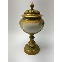A Royal Worcester potpourri vase and cover, shape 1813, the bulbous body hand painted with pink roses and signed A Watkins, supporting a gilded and burnished pierced cover, upon a moulded stem with zoomorphic mask detail and circular foot, with puce printed mark beneath, H24cm