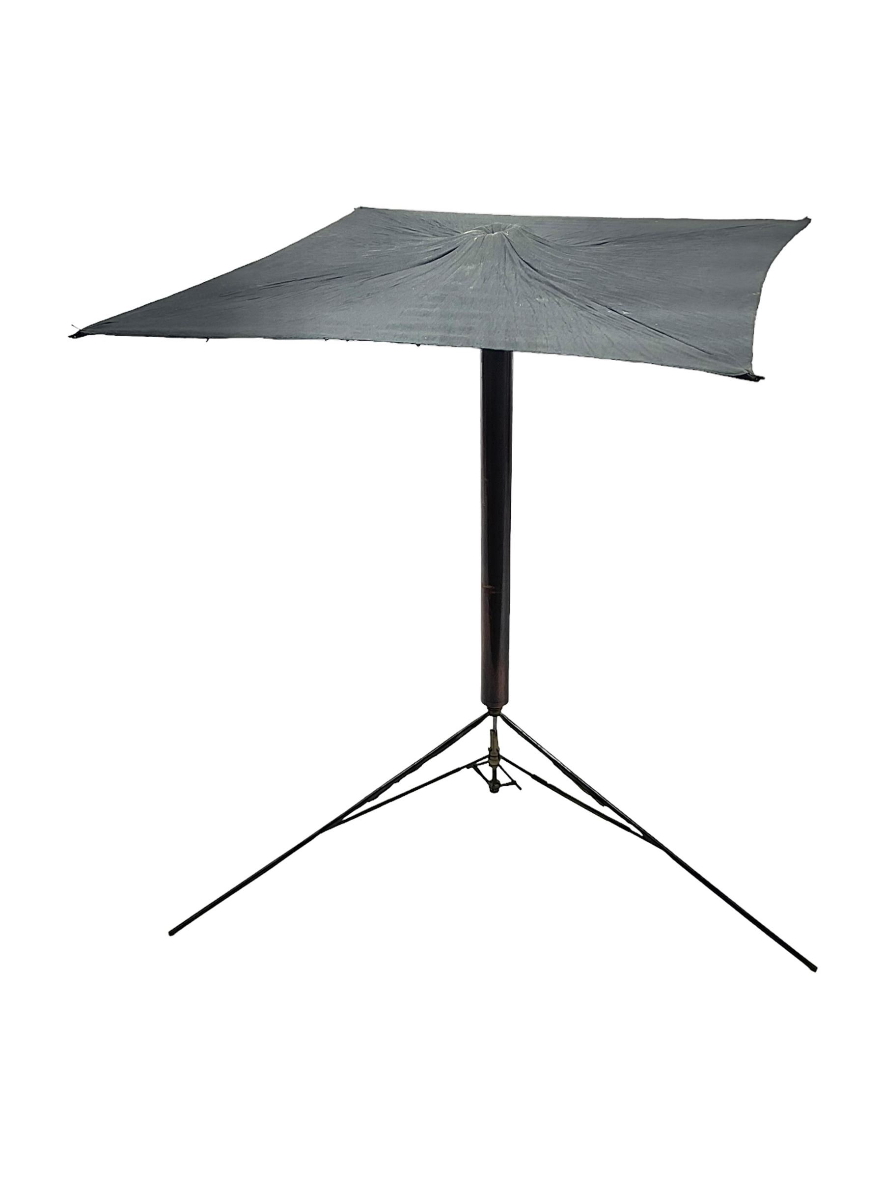 Victorian magician's cane, the mahogany walking stick twisting apart to reveal an internal mechanism, opening to tripod and black silk fold out magician's table, with horn handle and silver mount, hallmarked Birmingham 1891