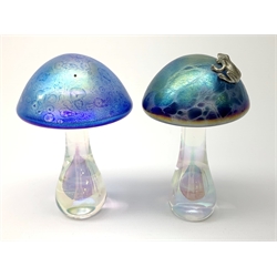 A John Ditchfield Glasform mushroom, in irridescent blue surmounted with a frog, H10.5cm, together with another similar John Ditchfield example. 